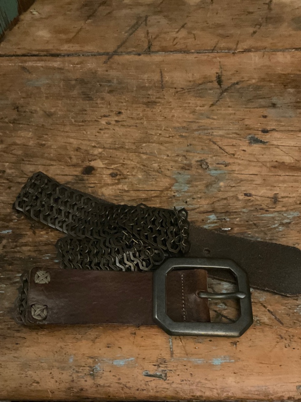 Edgy and amazing Streets Ahead metal link and brown oiled leather belt.